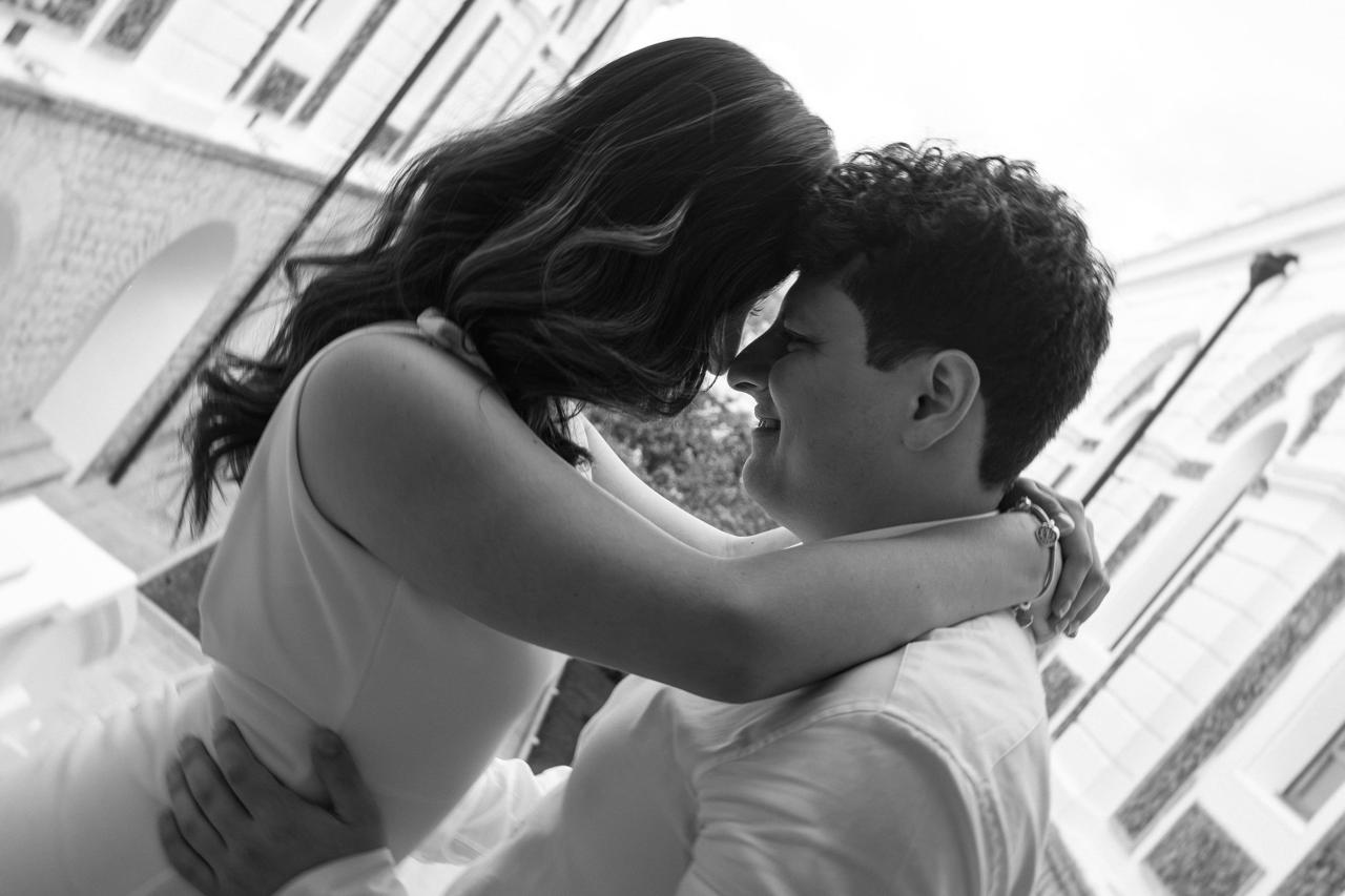Couple embracing forehead to forehead in black and white